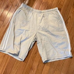 Nike men’s xl drawstring shorts. Light tan/cream color with white detailing.